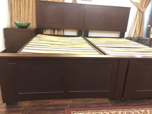Single wooden beds slightly used
